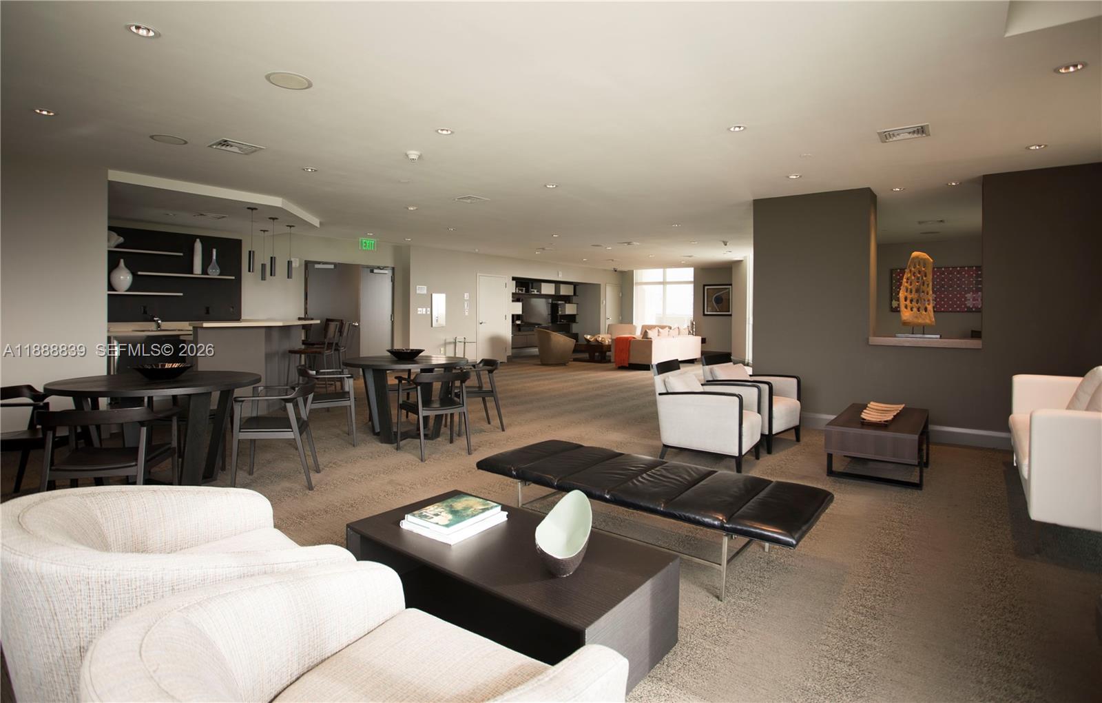 2525 Southwest 3rd Avenue, Unit 1106 Miami, FL 33129 - Photo 31 of 36 a living room with furniture a wooden floor and kitchen view