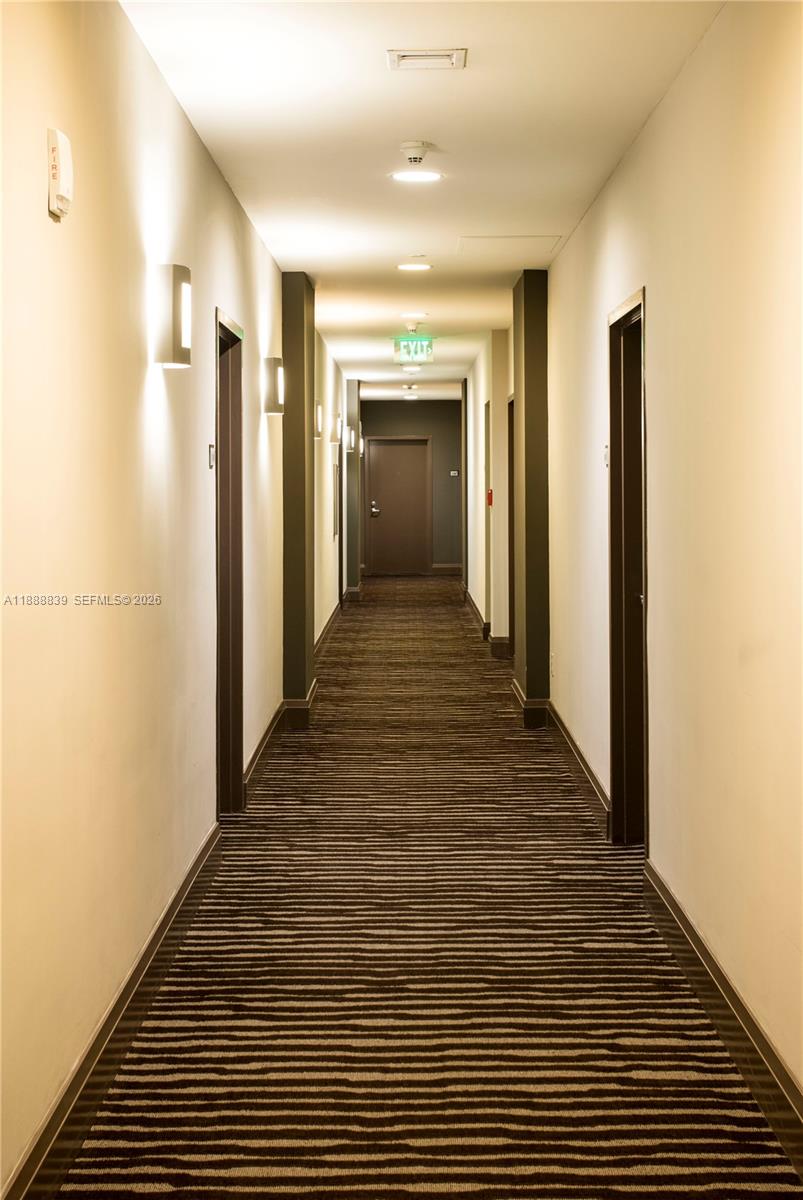 2525 Southwest 3rd Avenue, Unit 1106 Miami, FL 33129 - Photo 35 of 36 a view of a hallway with wooden floor and staircase