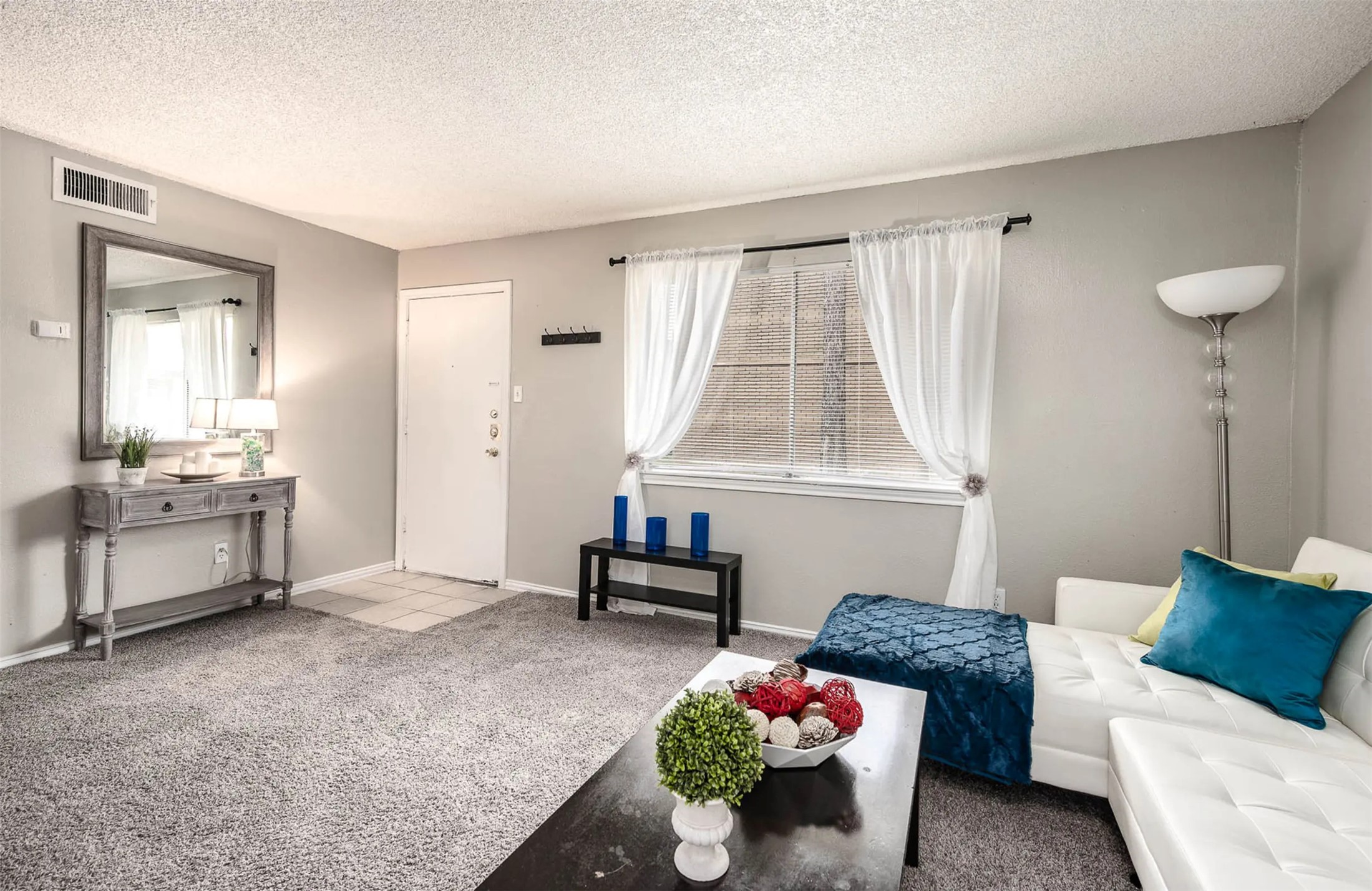 4343 Shaver Street, Unit 1002 Pasadena, TX 77504 - Photo 6 of 14 a living room with furniture and a window