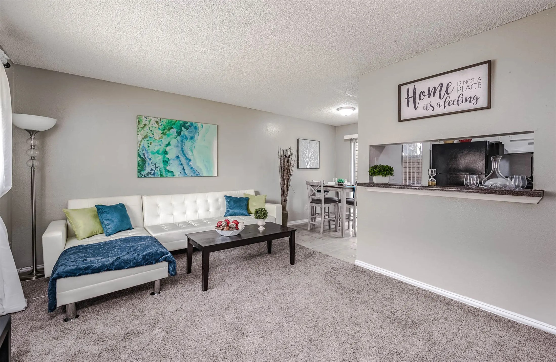 4343 Shaver Street, Unit 1002 Pasadena, TX 77504 - Photo 7 of 14 a living room with furniture and a flat screen tv