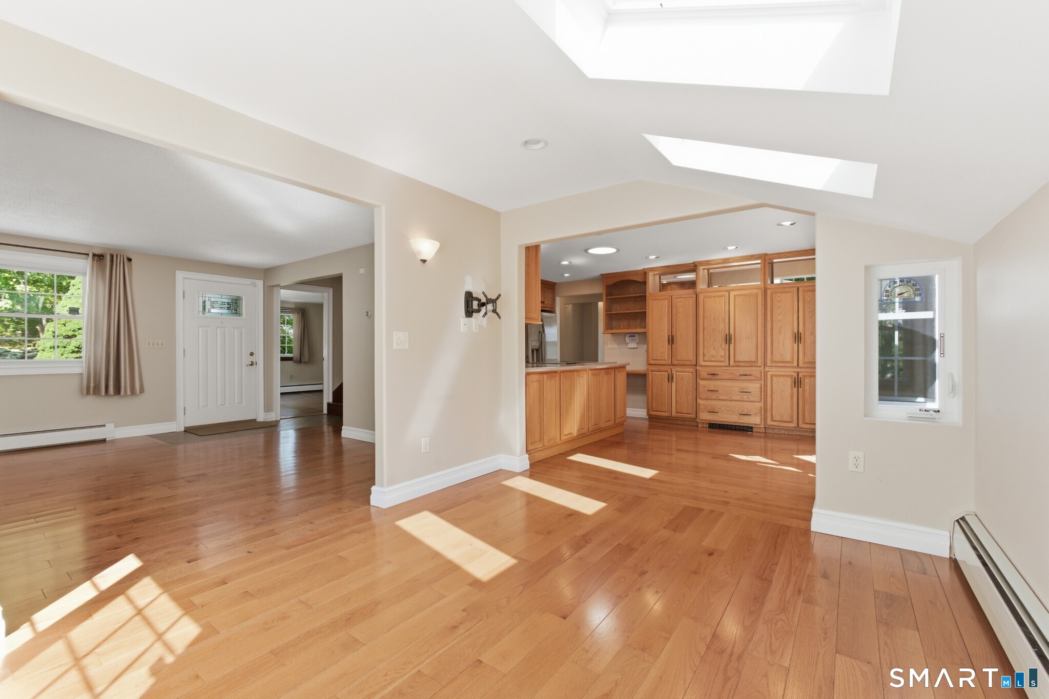 70 Mahoney Road Colchester, CT 06415 - Photo 3 of 40 a view of a big room with wooden floor and windows