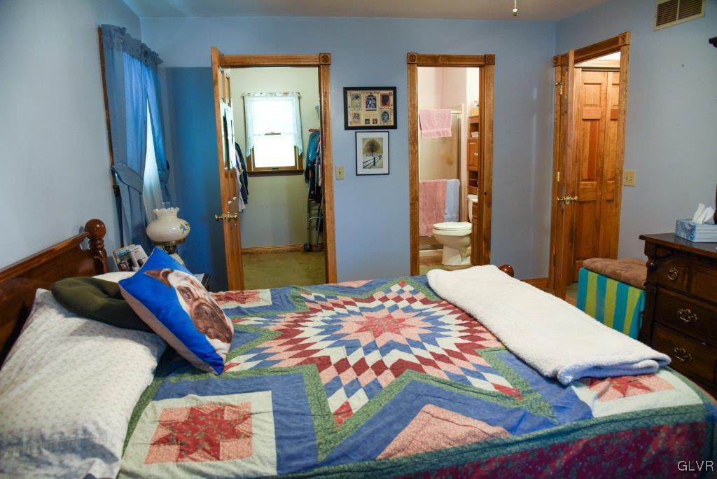 974 Renaldi Road Wind Gap, PA 18091 - Photo 26 of 40 a bedroom with bed and wooden floor