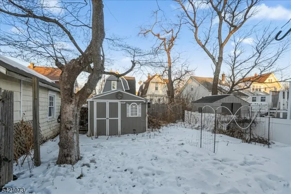 a view of multiple houses with yard