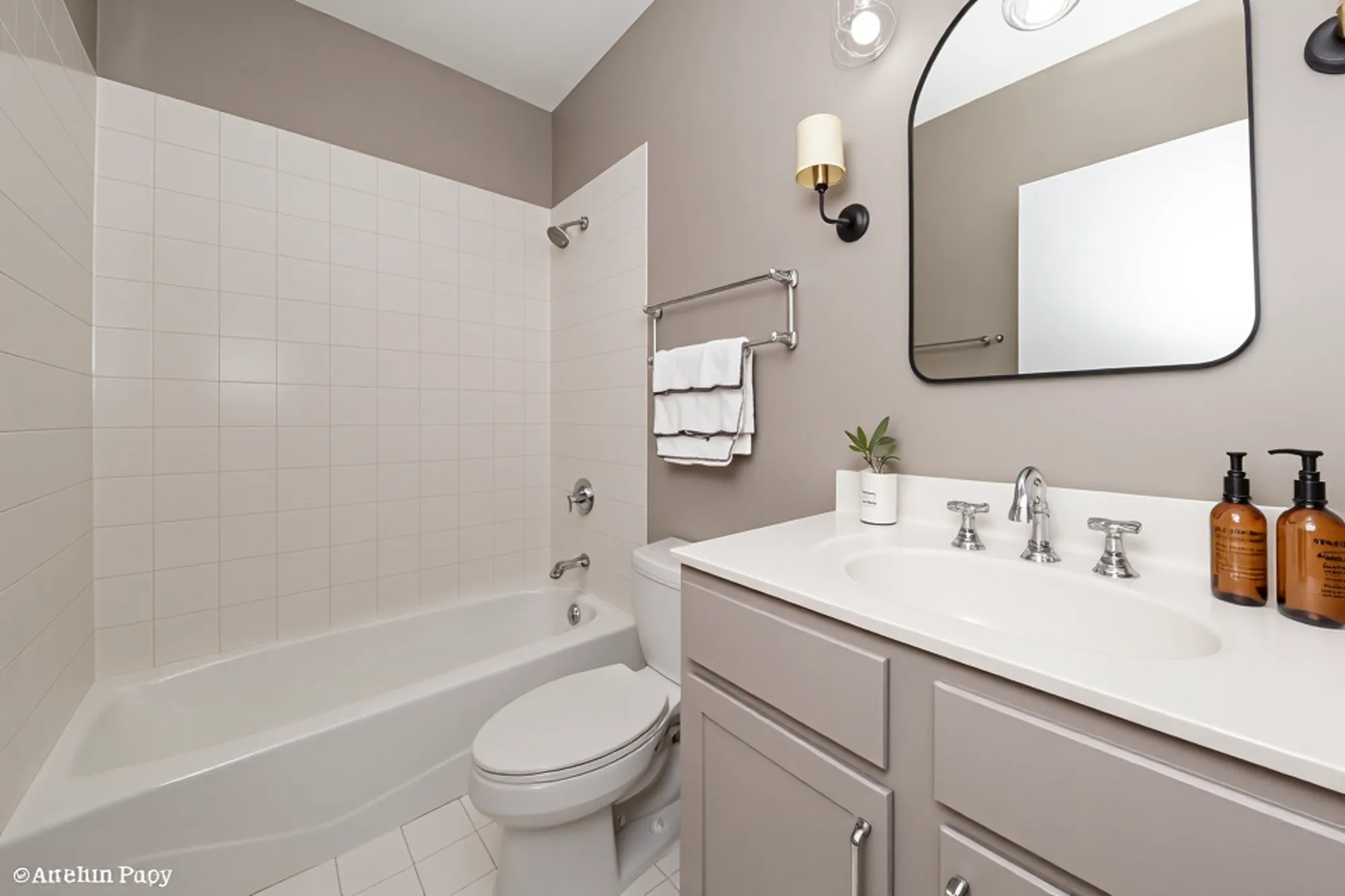 330 North Clinton Street, Unit 303 Chicago, IL 60661 - Photo 12 of 14 a bathroom with a sink toilet and shower