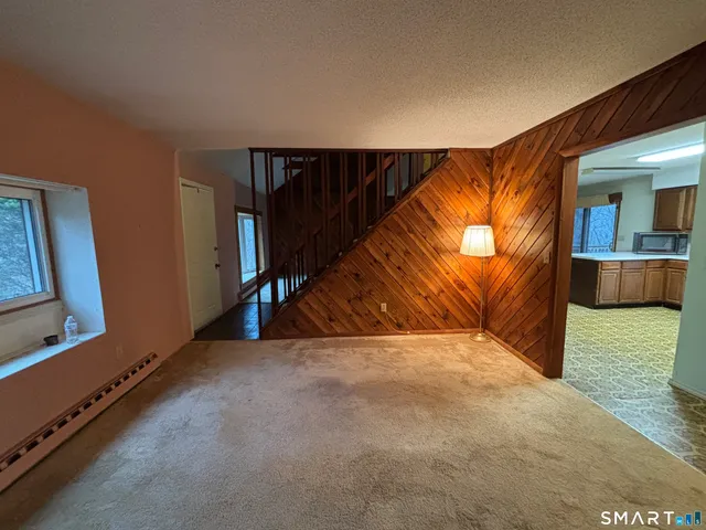 a view of an empty room with a fireplace