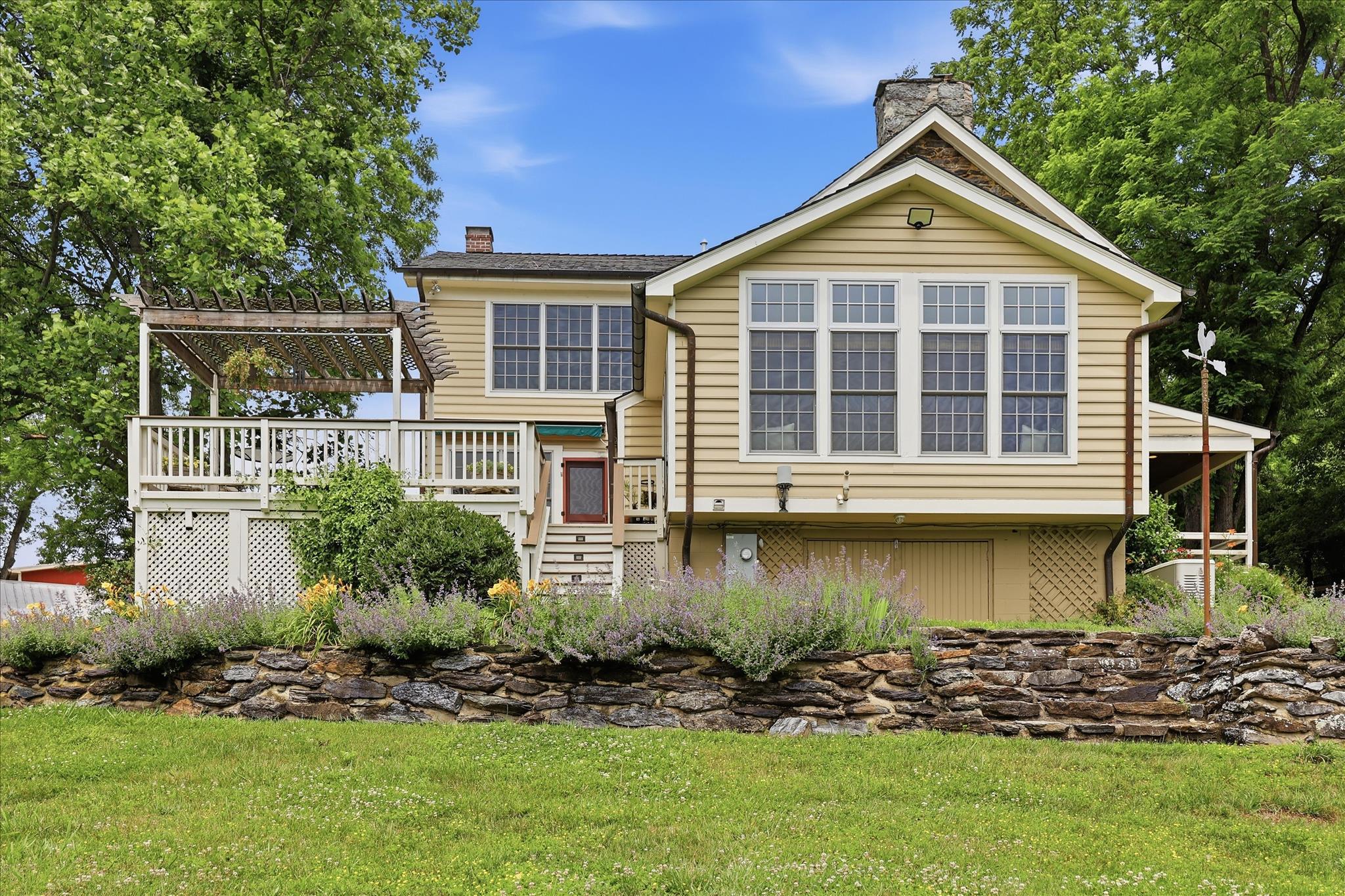 10919 Etzler Mill Road Woodsboro, MD 21798 - Photo 39 of 54 a front view of a house with a yard