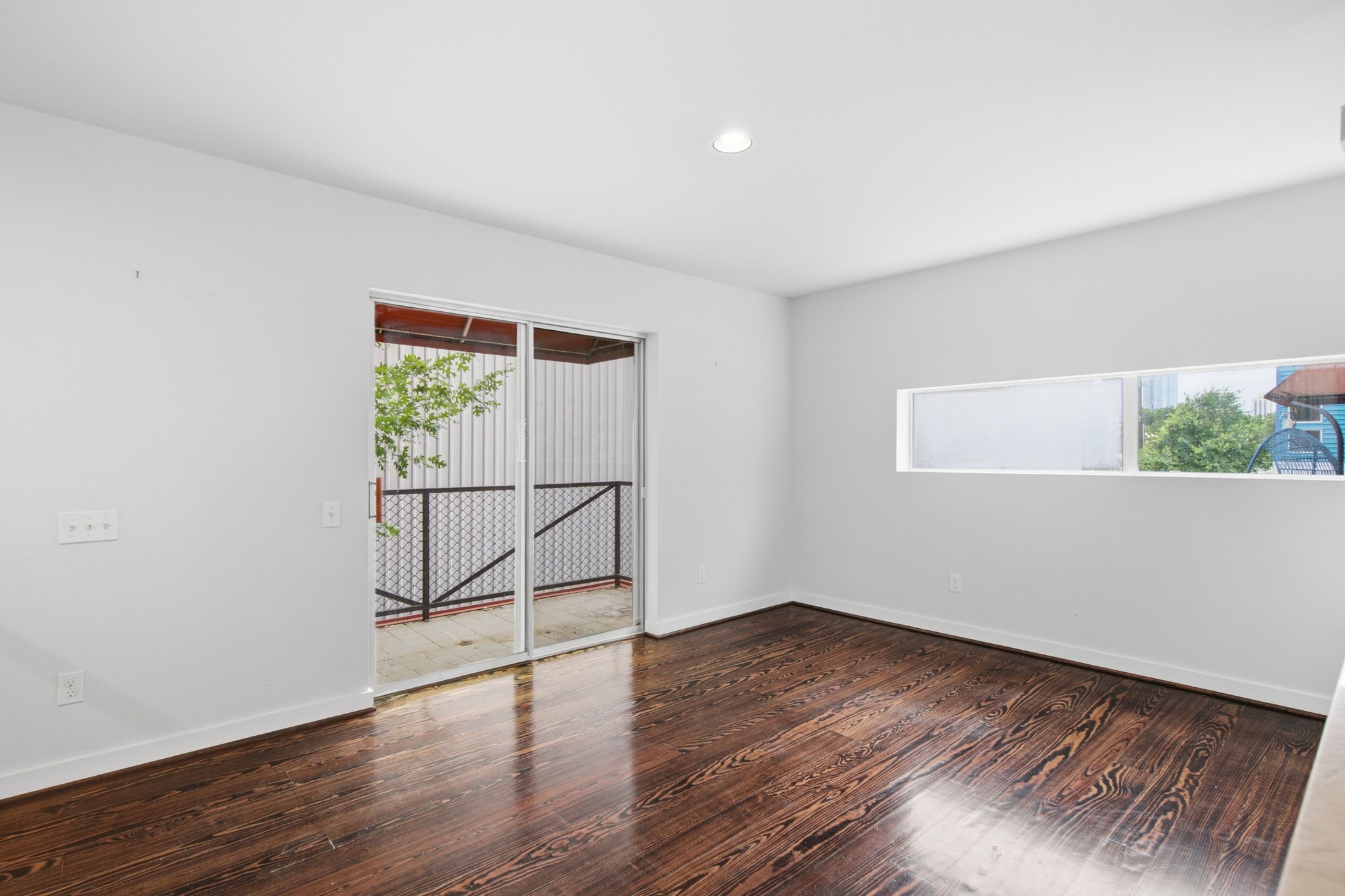 2934 Commerce Street Houston, TX 77003 - Photo 16 of 44 a view of an empty room with wooden floor