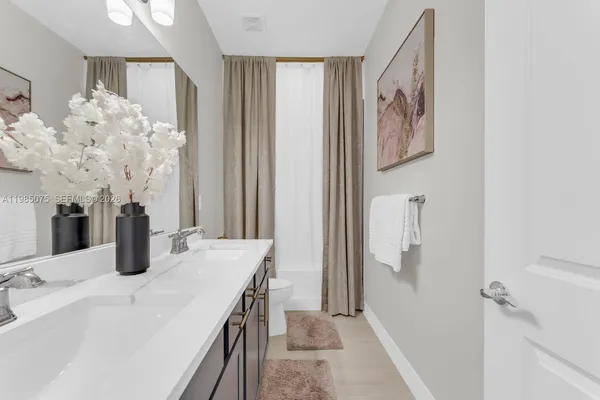 a bedroom with double bed and a window