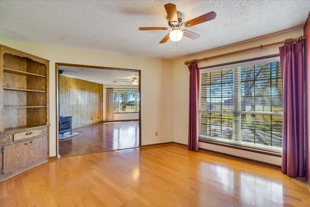 a kitchen with a sink a counter top space and stainless steel appliances