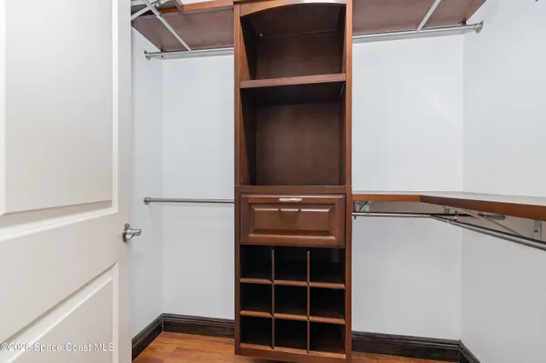 a view of closet area with empty racks