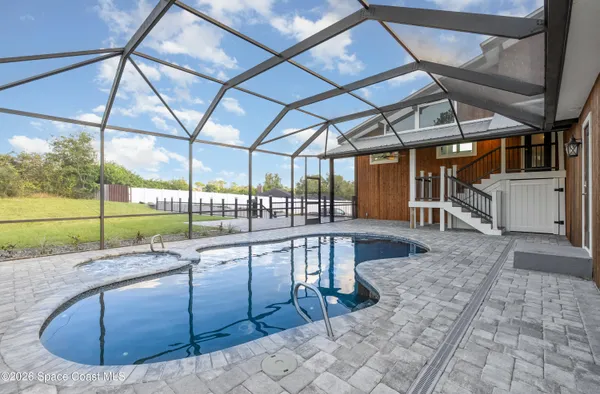 a view of a swimming pool with a porch