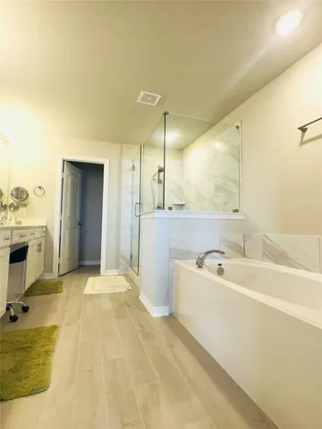 a spacious bathroom with a double vanity sink mirror and double