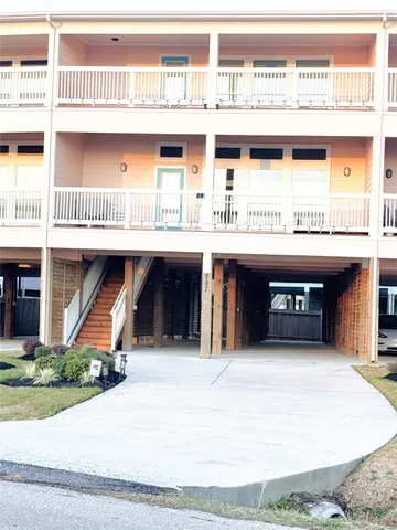 a living room with dining table furniture and a floor to ceiling window
