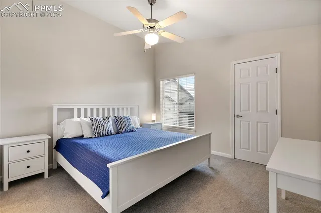 a living room with a bed and a chandelier