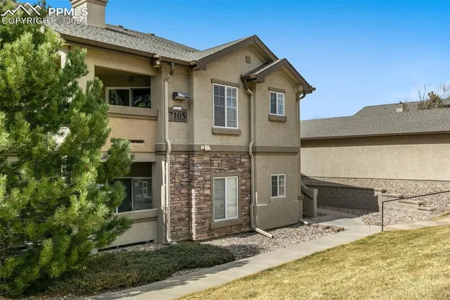 a living room with furniture and white walls