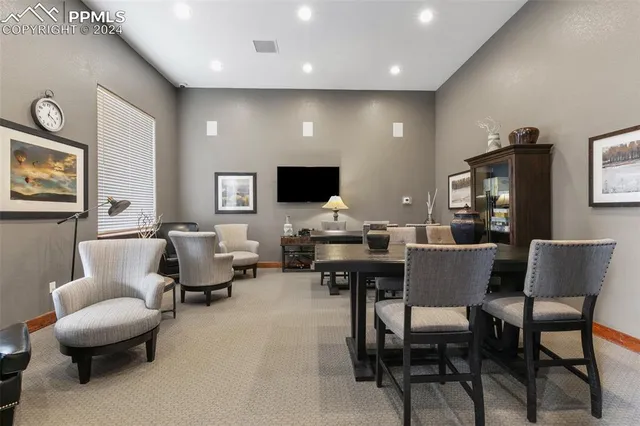 a kitchen with granite countertop a sink stove and cabinets