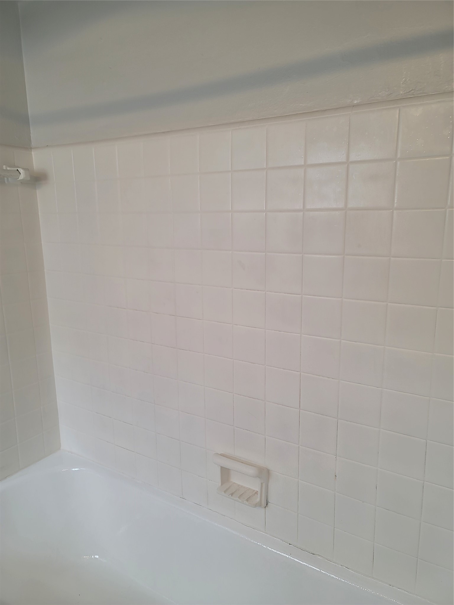 5622 Chartres Street, Unit 3 Houston, TX 77004 - Photo 10 of 14 a bathroom with a white shower and a white door