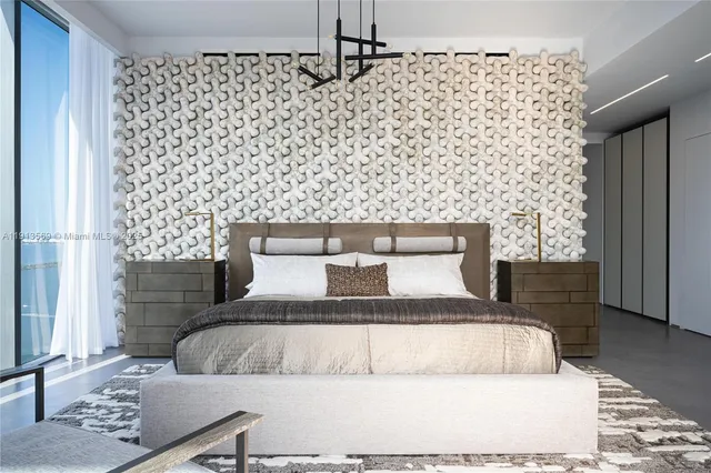 a bedroom with a bed and a wall painting