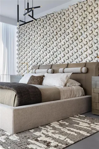 a living room with a couch and a rug