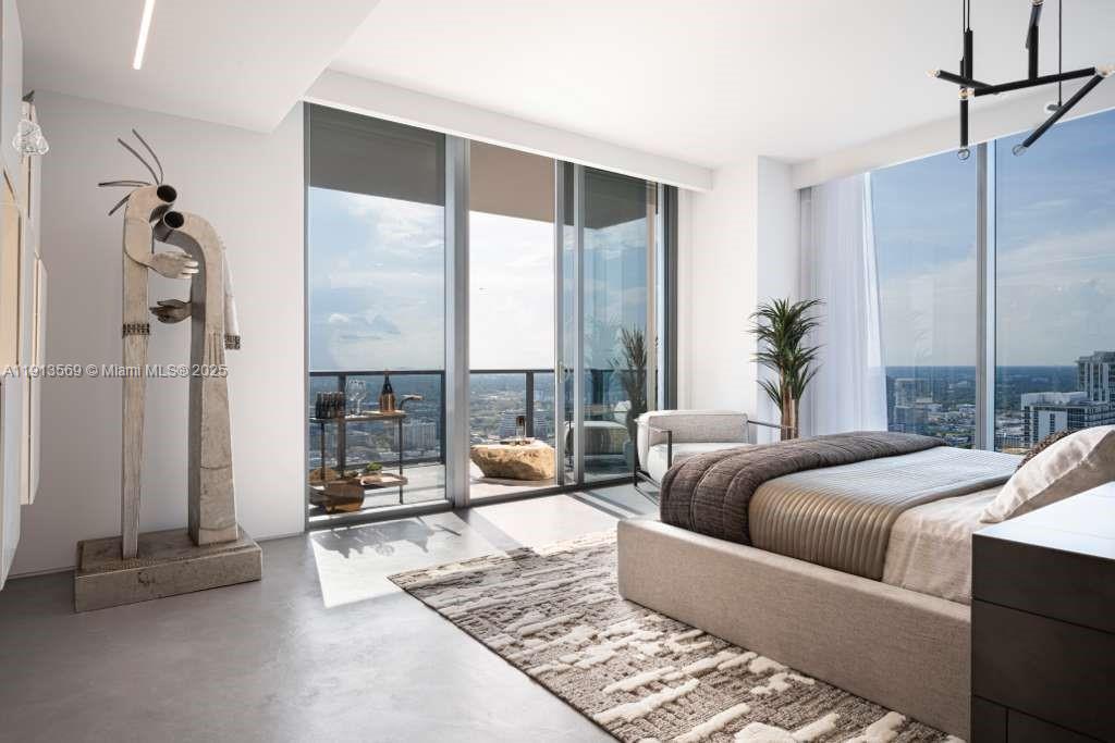 788 Northeast 23rd Street, Unit 4102 Miami, FL 33137 - Photo 13 of 41 a living room with furniture and a floor to ceiling window