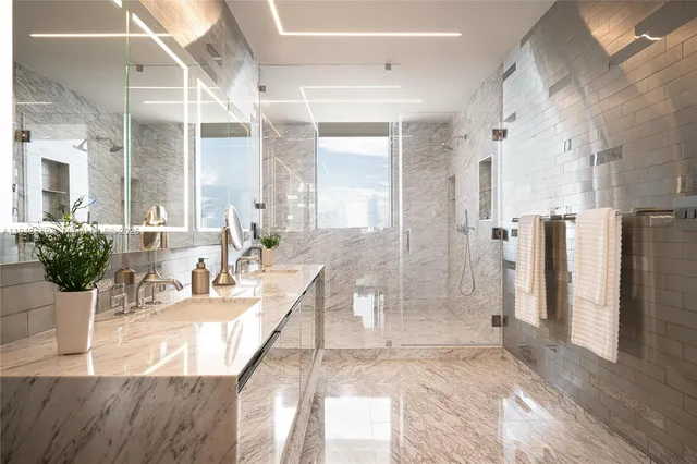 a large white kitchen with a large window