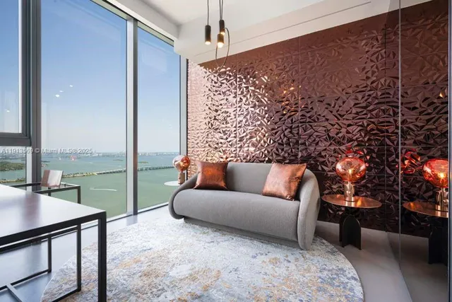 a balcony with furniture and large window