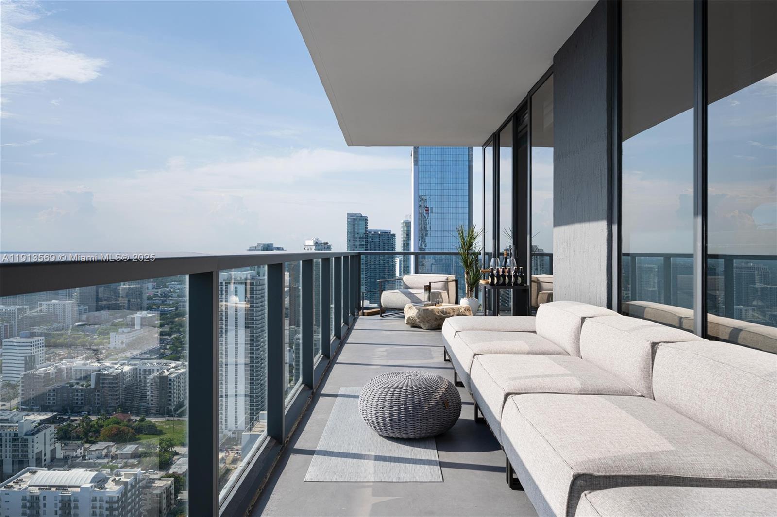 788 Northeast 23rd Street, Unit 4102 Miami, FL 33137 - Photo 20 of 41 a balcony with furniture and large window