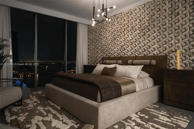 a bedroom with a bed and a chandelier
