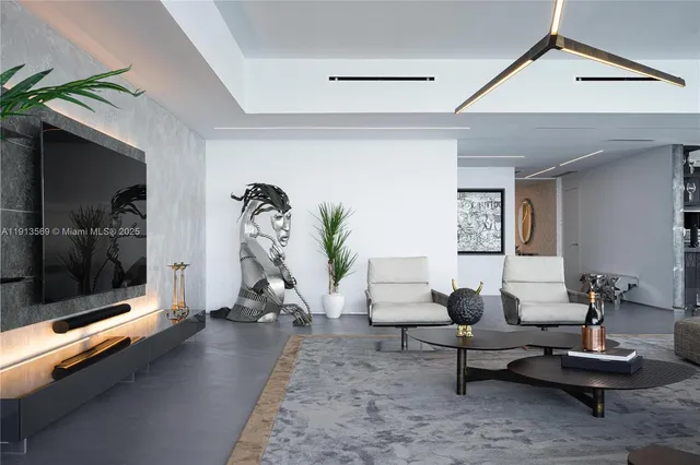 a living room with furniture a window and a potted plant