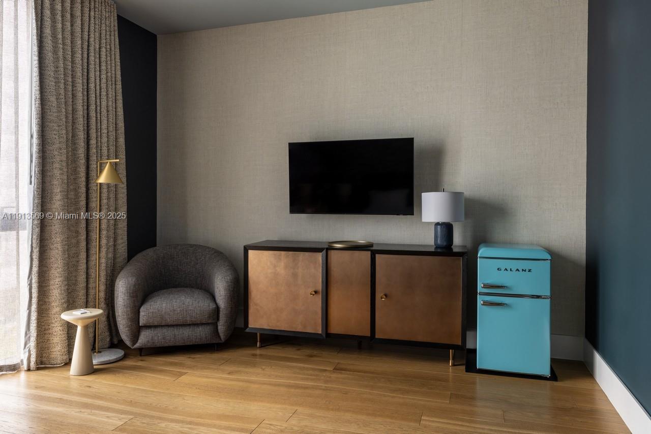 788 Northeast 23rd Street, Unit 4102 Miami, FL 33137 - Photo 38 of 41 a living room with furniture and a flat screen tv