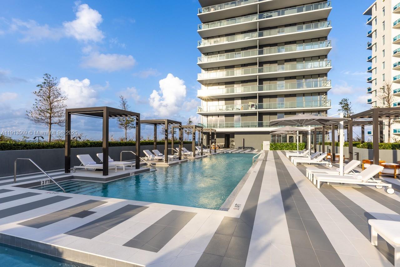 788 Northeast 23rd Street, Unit 4102 Miami, FL 33137 - Photo 39 of 41 a view of a swimming pool with outdoor seating