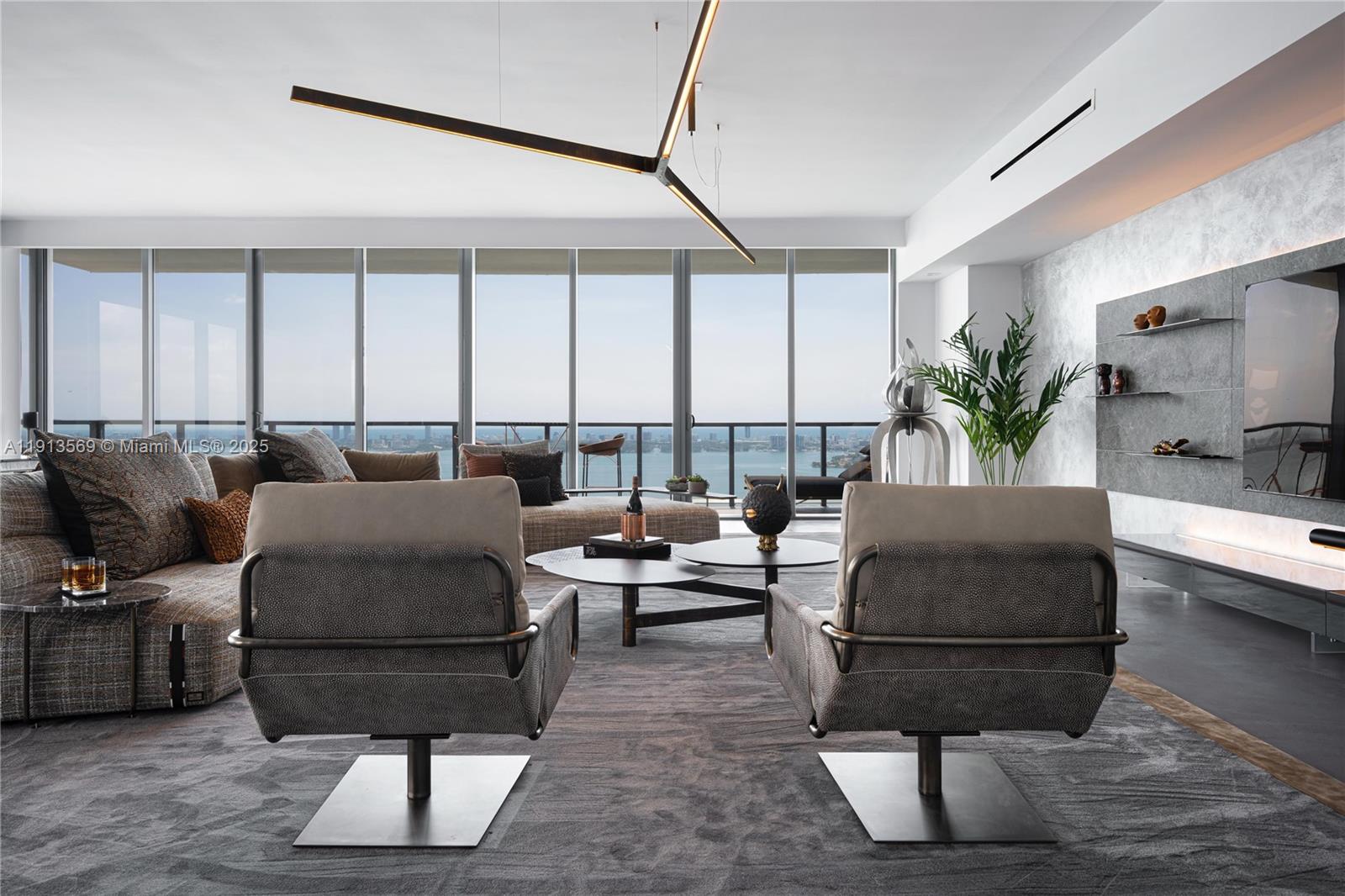 788 Northeast 23rd Street, Unit 4102 Miami, FL 33137 - Photo 4 of 41 a living room with furniture and a potted plant