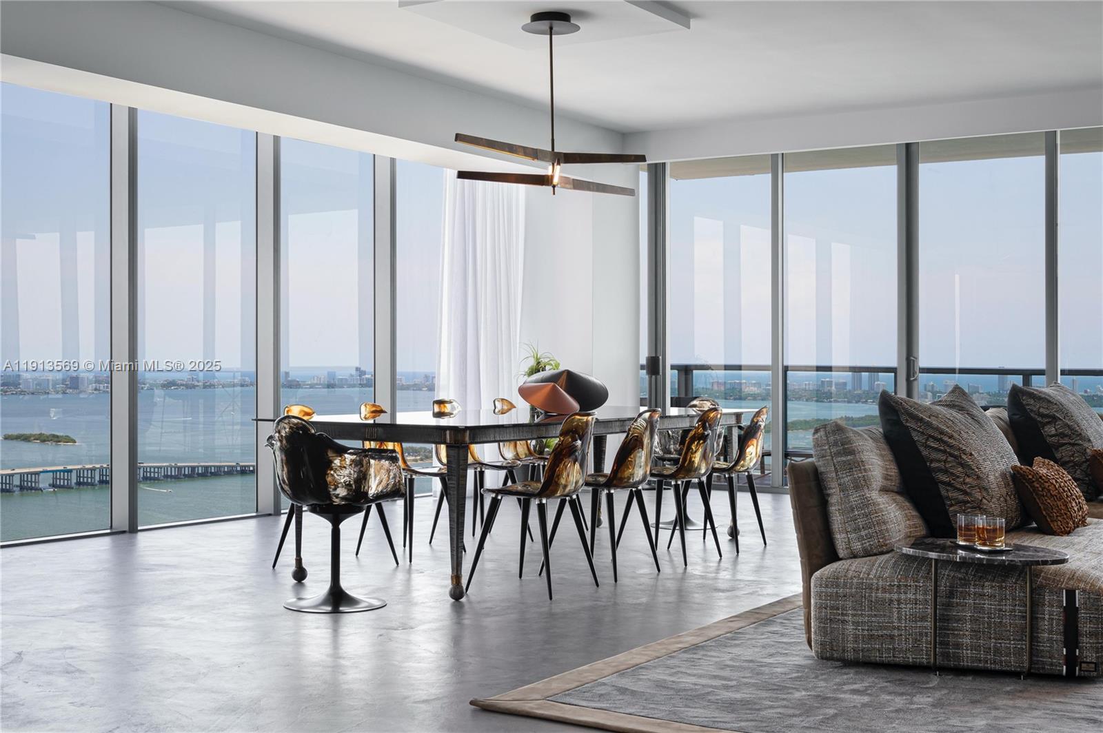 788 Northeast 23rd Street, Unit 4102 Miami, FL 33137 - Photo 6 of 41 a dining room with furniture window and wooden floor