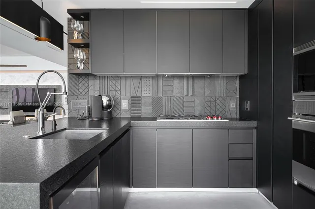 a kitchen with a sink and cabinets