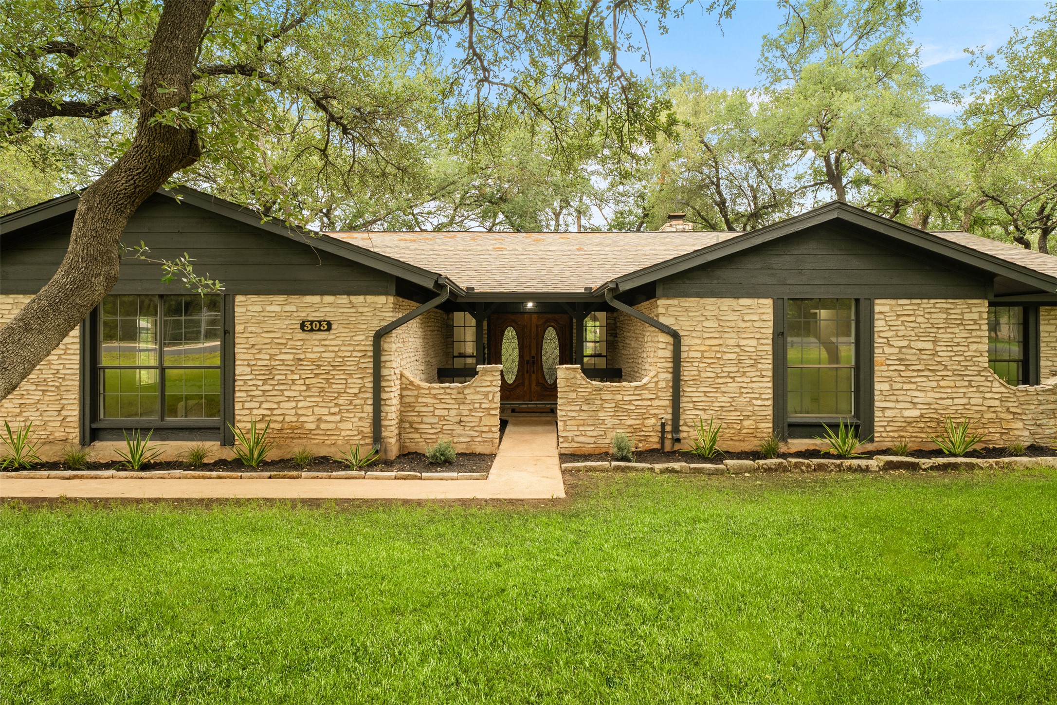 303 West Sequoia Spur Georgetown, TX 78628 - Photo 32 of 34 a front view of a house with a yard