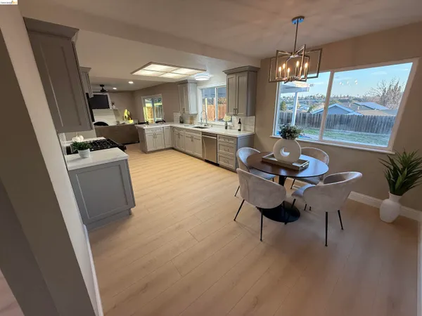 a view of a dining room with furniture window and outside view