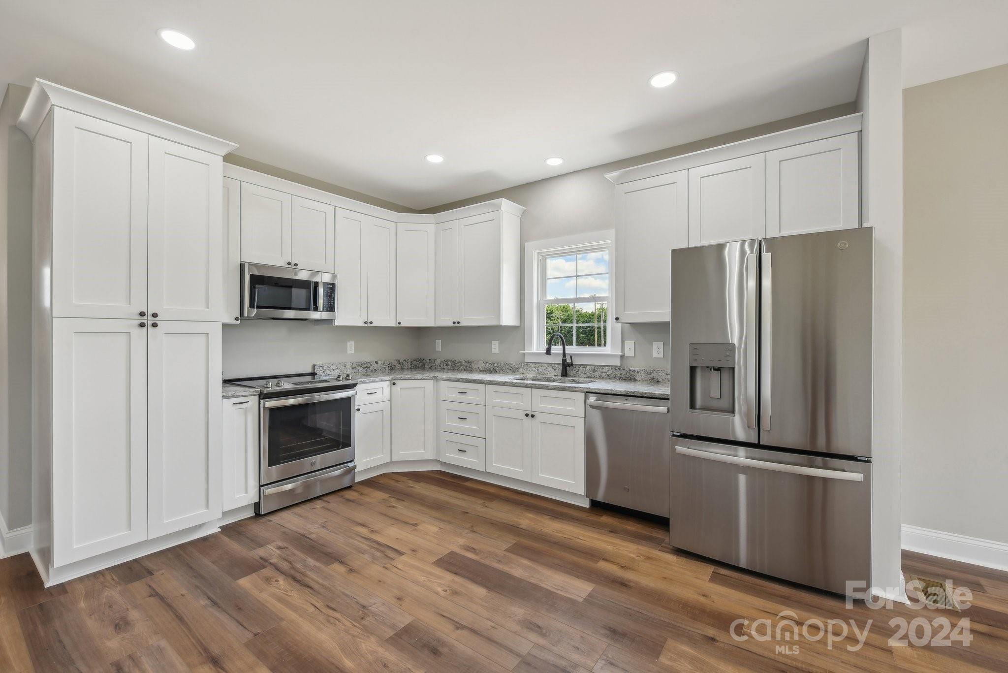 158 Wetmore Road Woodleaf, NC 27054 - Photo 15 of 33 a kitchen with a refrigerator stove and microwave