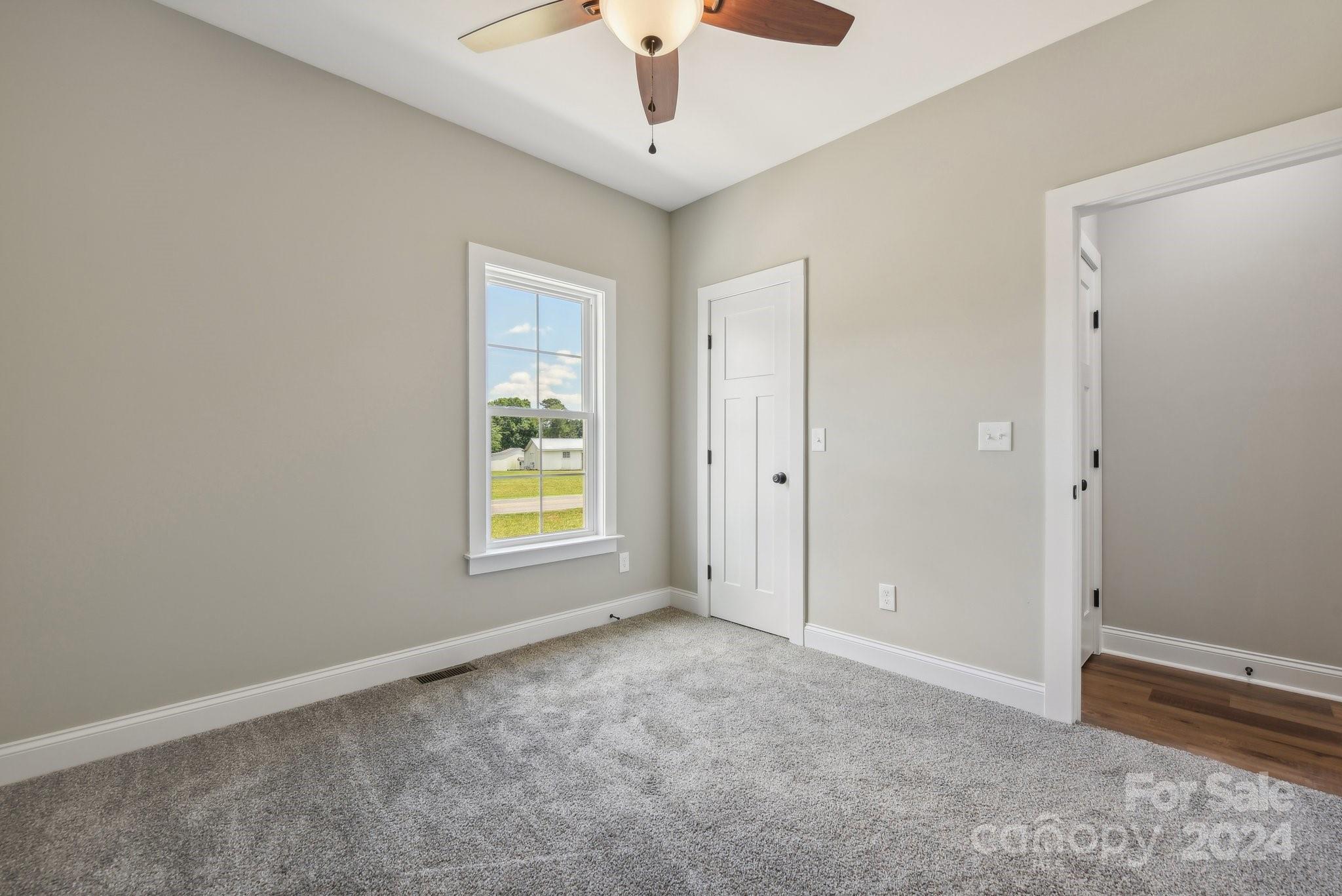 158 Wetmore Road Woodleaf, NC 27054 - Photo 25 of 33 a view of an empty room with a window