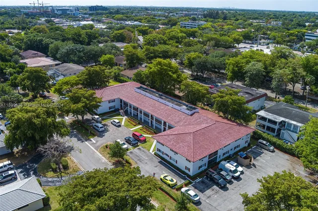 an aerial view of a house with a garden