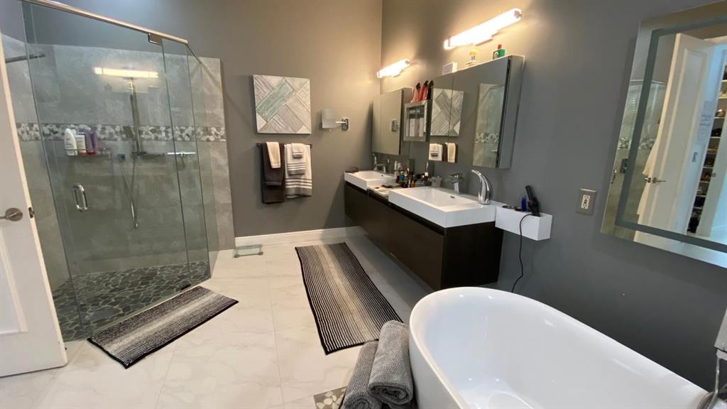 830 Bailey Street Boca Raton, FL 33487 - Photo 13 of 24 a bathroom with a sink a toilet and shower