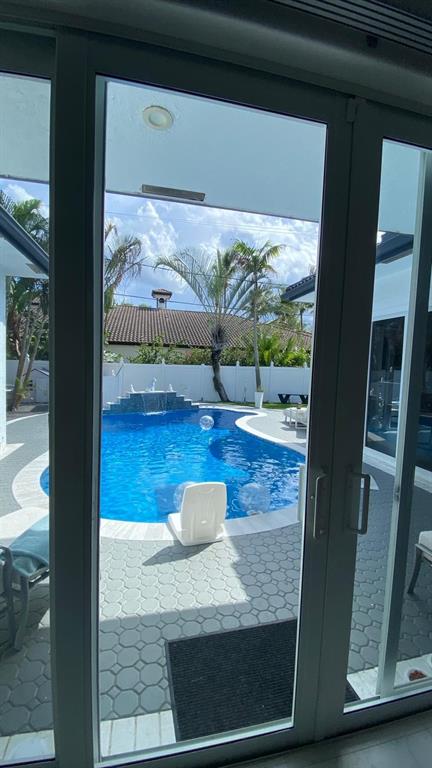 830 Bailey Street Boca Raton, FL 33487 - Photo 20 of 24 a view of living room with furniture and floor to ceiling window