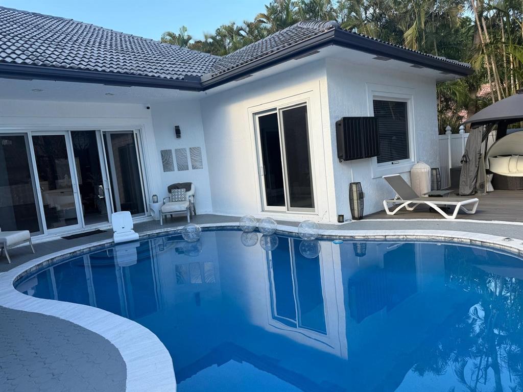 830 Bailey Street Boca Raton, FL 33487 - Photo 21 of 24 a view of a house with pool table and chairs