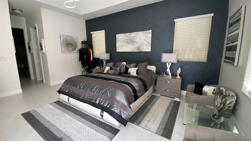 830 Bailey Street Boca Raton, FL 33487 - Photo 10 of 24 a bedroom with bed and a window