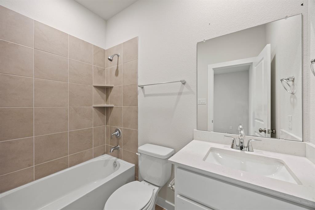 1012 Verde Valley Lane Crowley, TX 76036 - Photo 12 of 19 a bathroom with a sink toilet and shower