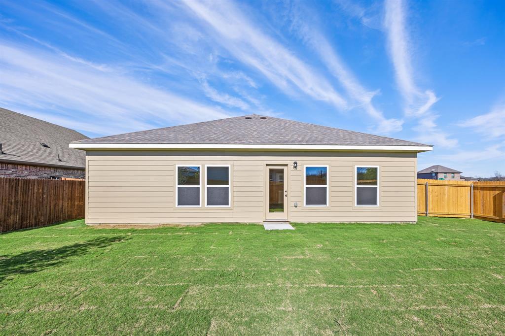 1012 Verde Valley Lane Crowley, TX 76036 - Photo 14 of 19 a front view of house with yard and green space