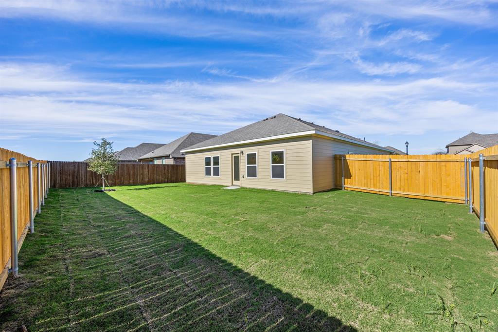 1012 Verde Valley Lane Crowley, TX 76036 - Photo 15 of 19 a view of an house with backyard space and garden