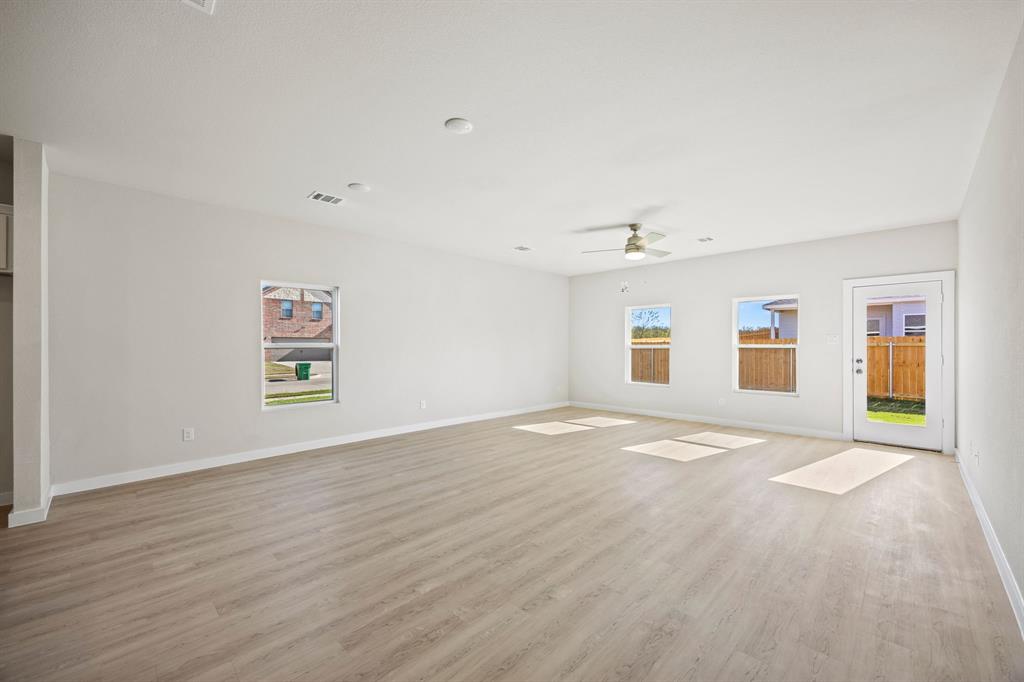 1012 Verde Valley Lane Crowley, TX 76036 - Photo 3 of 19 a view of empty room with wooden floor and fan