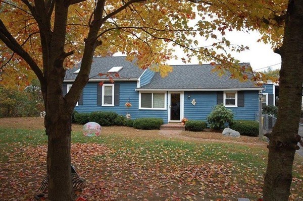 99 Indian Run Road Bellingham, MA 02019 - Photo 4 of 18 a front view of a house with garden and trees