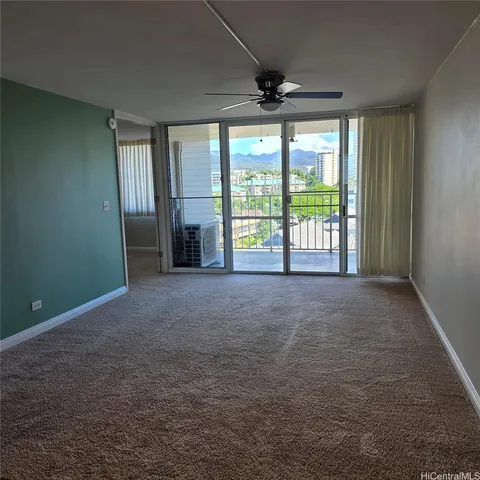 a view of an empty room with a window