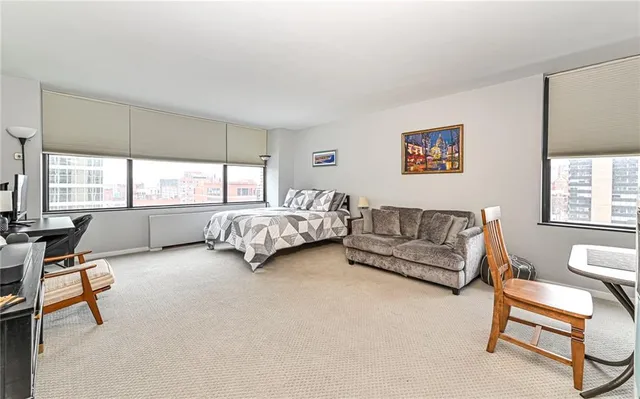 a bedroom with furniture and a window